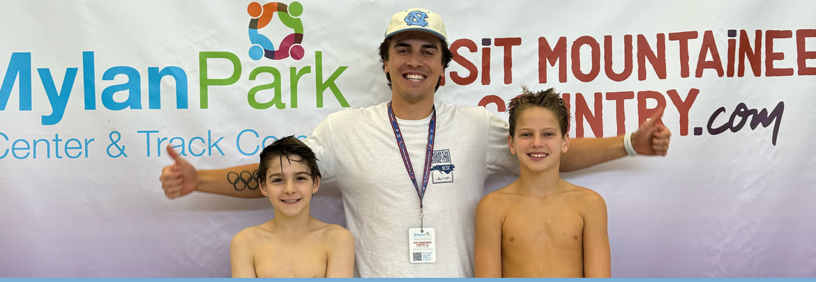 swimmers with coach
